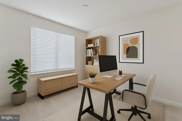 a workspace with furniture and a potted plant