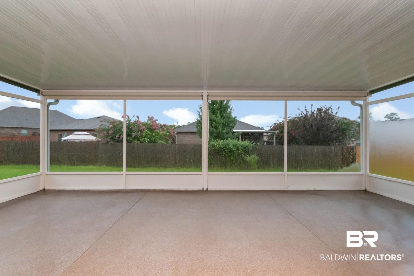 10714 Brodick Loop Spanish Fort, AL 36527 - Photo 24 of 26 Unfurnished sunroom featuring concrete floors