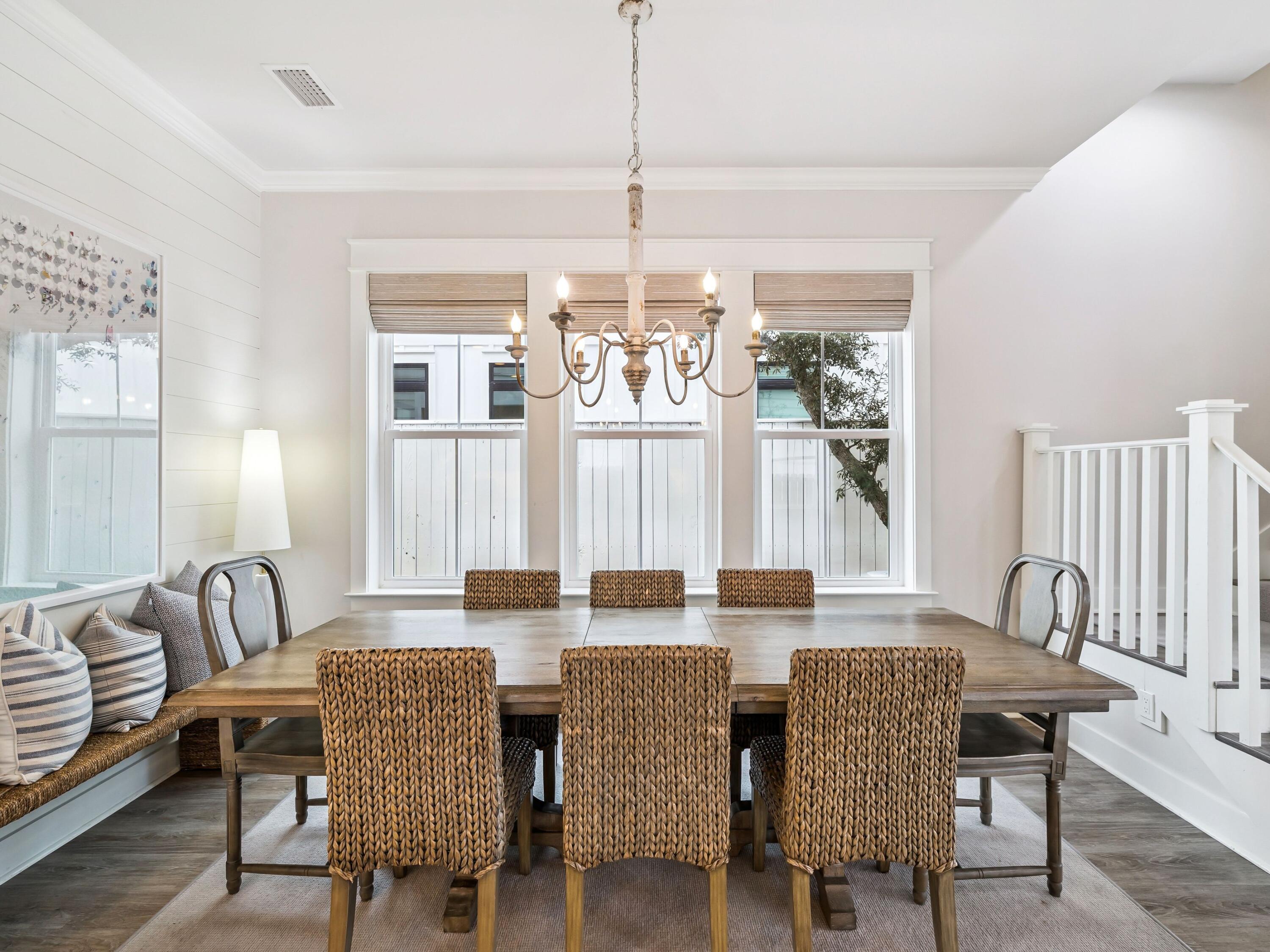 29 Tidewater Ct Inlet Beach Inlet Beach, FL 32461 - Photo 10 of 25 a dining room with furniture a chandelier and wooden floor