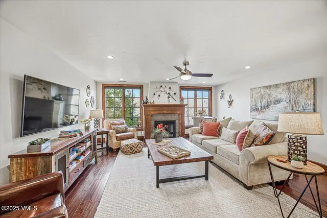 a living room with furniture and a flat screen tv