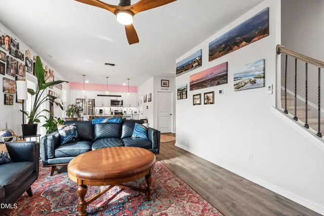 a living room with furniture and a rug