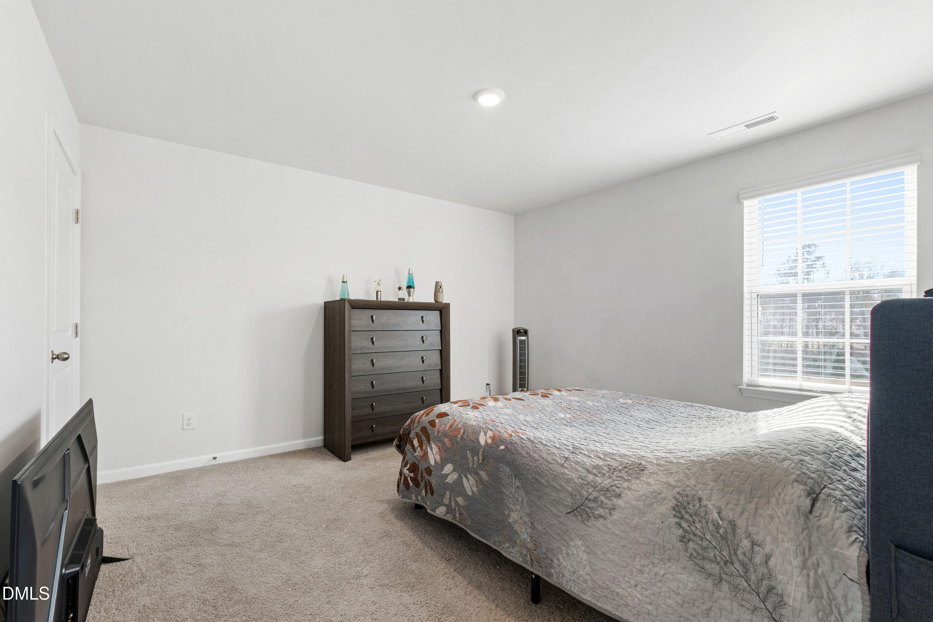 2128 Fletchers Ridge Drive Durham, NC 27703 - Photo 18 of 38 a bedroom with a bed and a television