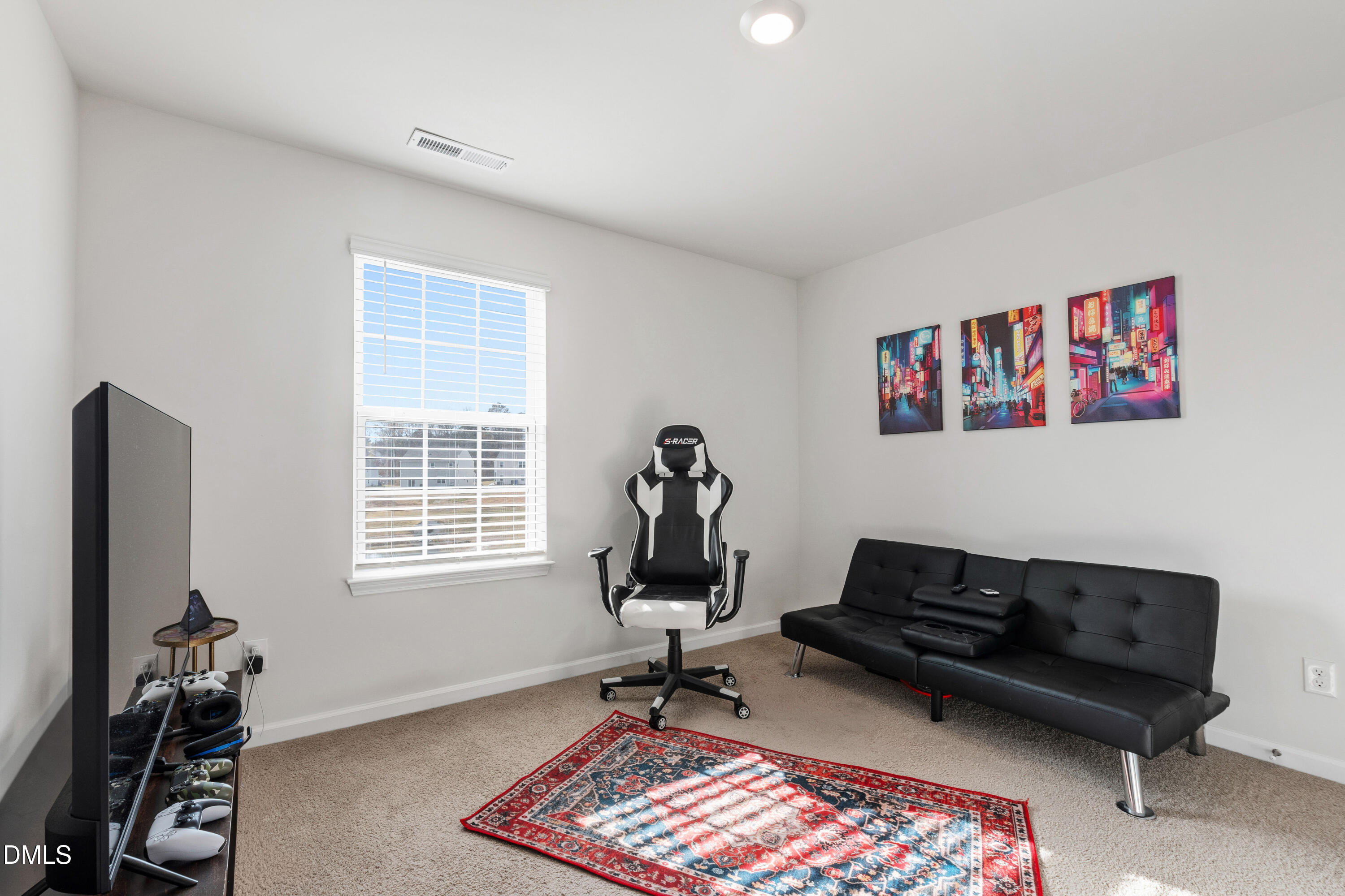 2128 Fletchers Ridge Drive Durham, NC 27703 - Photo 20 of 38 a living room with furniture gym equipment and a window