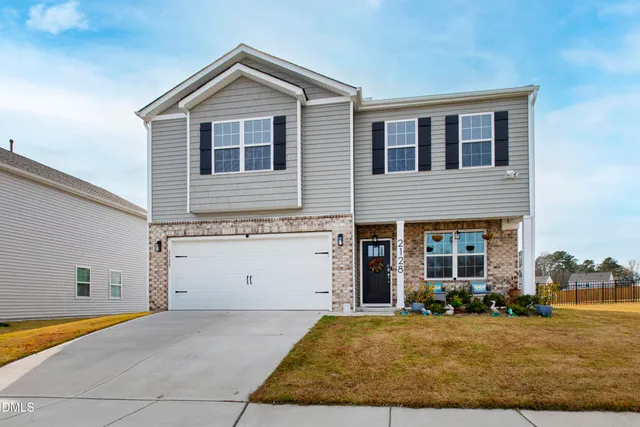 a view of a house with basketball court