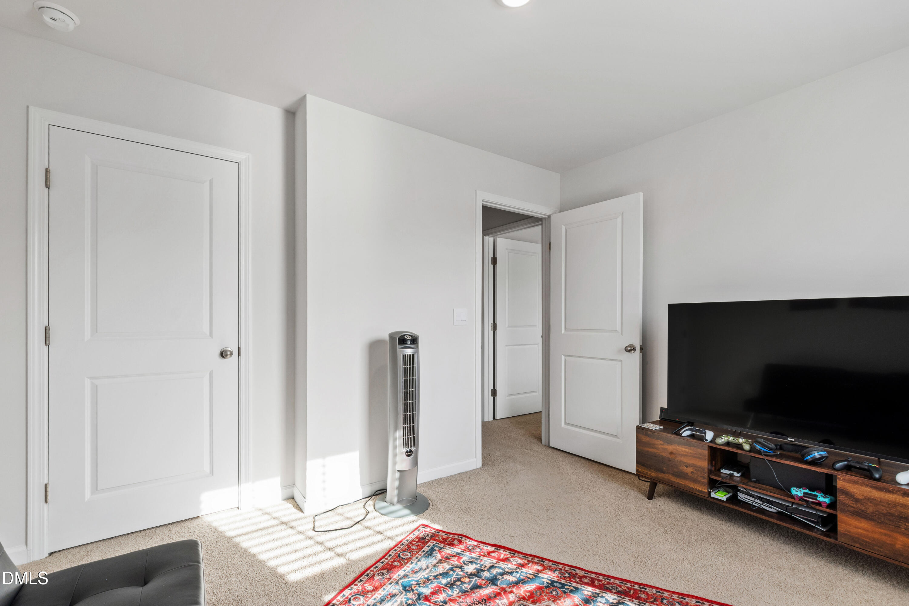 2128 Fletchers Ridge Drive Durham, NC 27703 - Photo 21 of 38 a living room with furniture and a flat screen tv