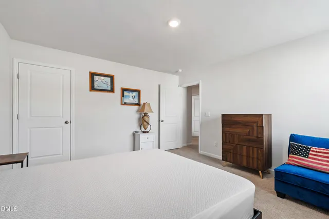 a bedroom with a bed and a cabinets