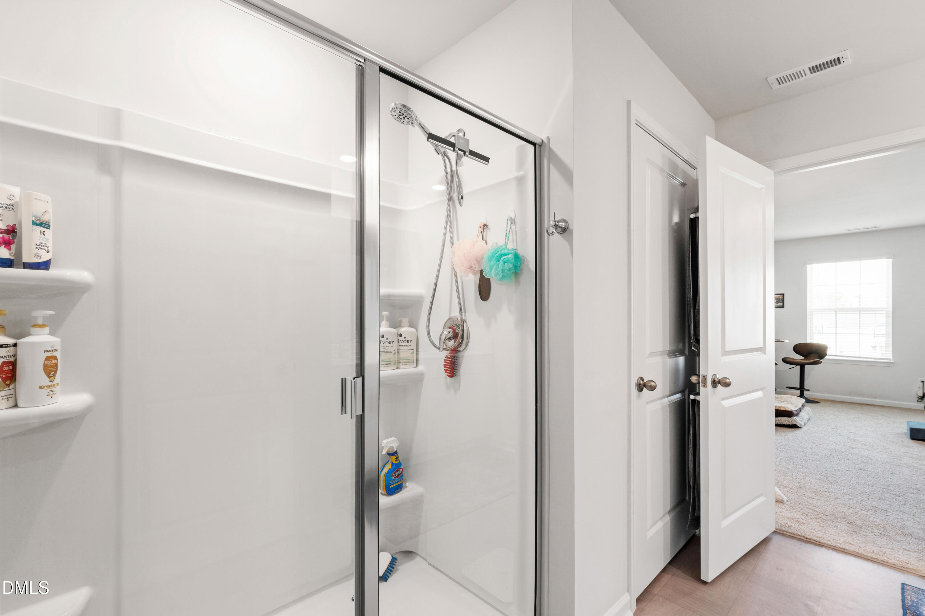 2128 Fletchers Ridge Drive Durham, NC 27703 - Photo 33 of 38 a bathroom with a shower and a glass door