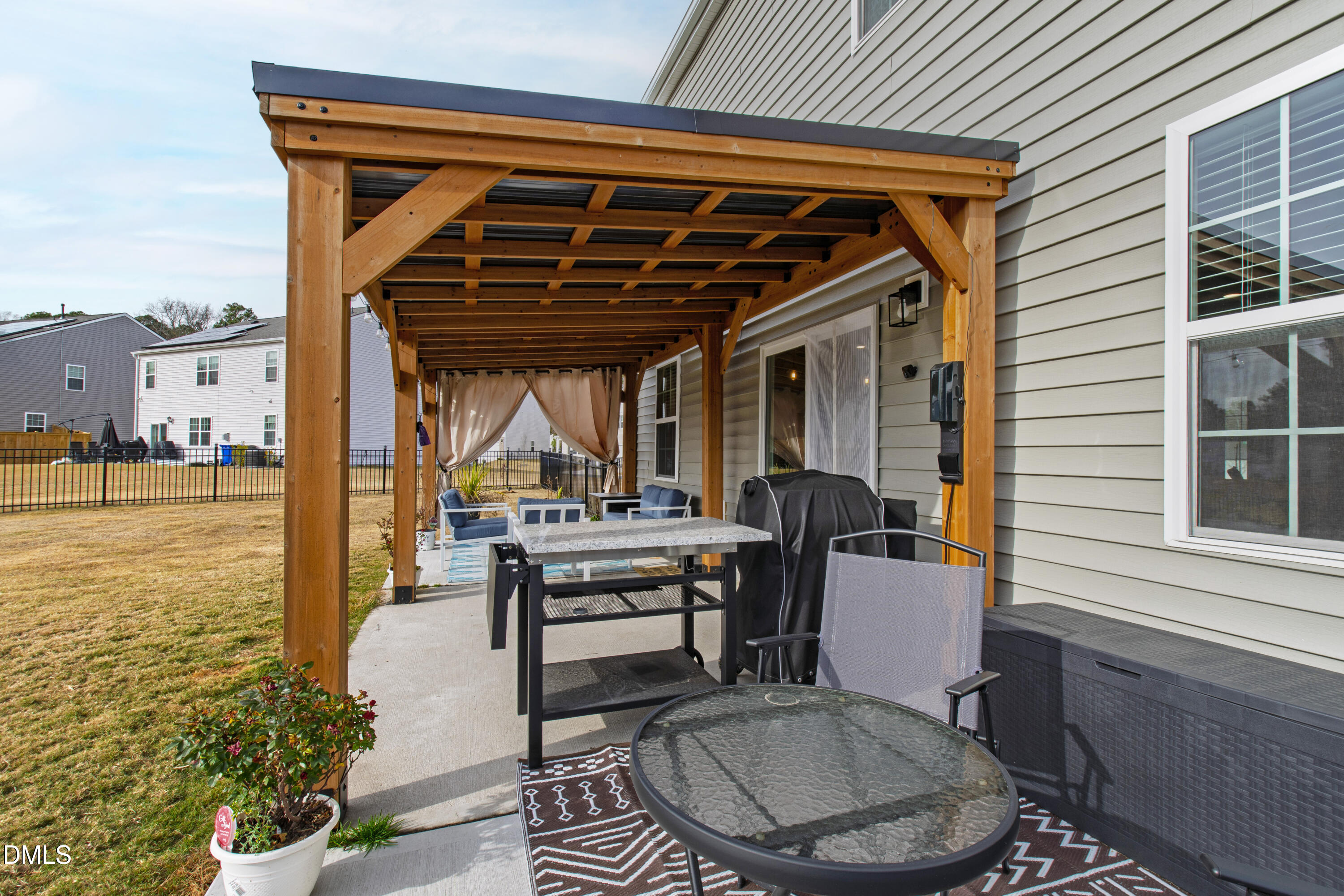 2128 Fletchers Ridge Drive Durham, NC 27703 - Photo 36 of 38 a patio with glass top table and chairs