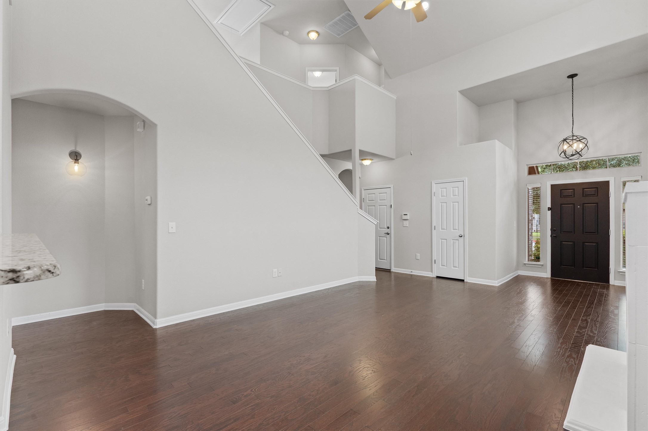 7709 Menchaca Road, Unit 22 Austin, TX 78745 - Photo 6 of 35 an empty room with wooden floor and entrance