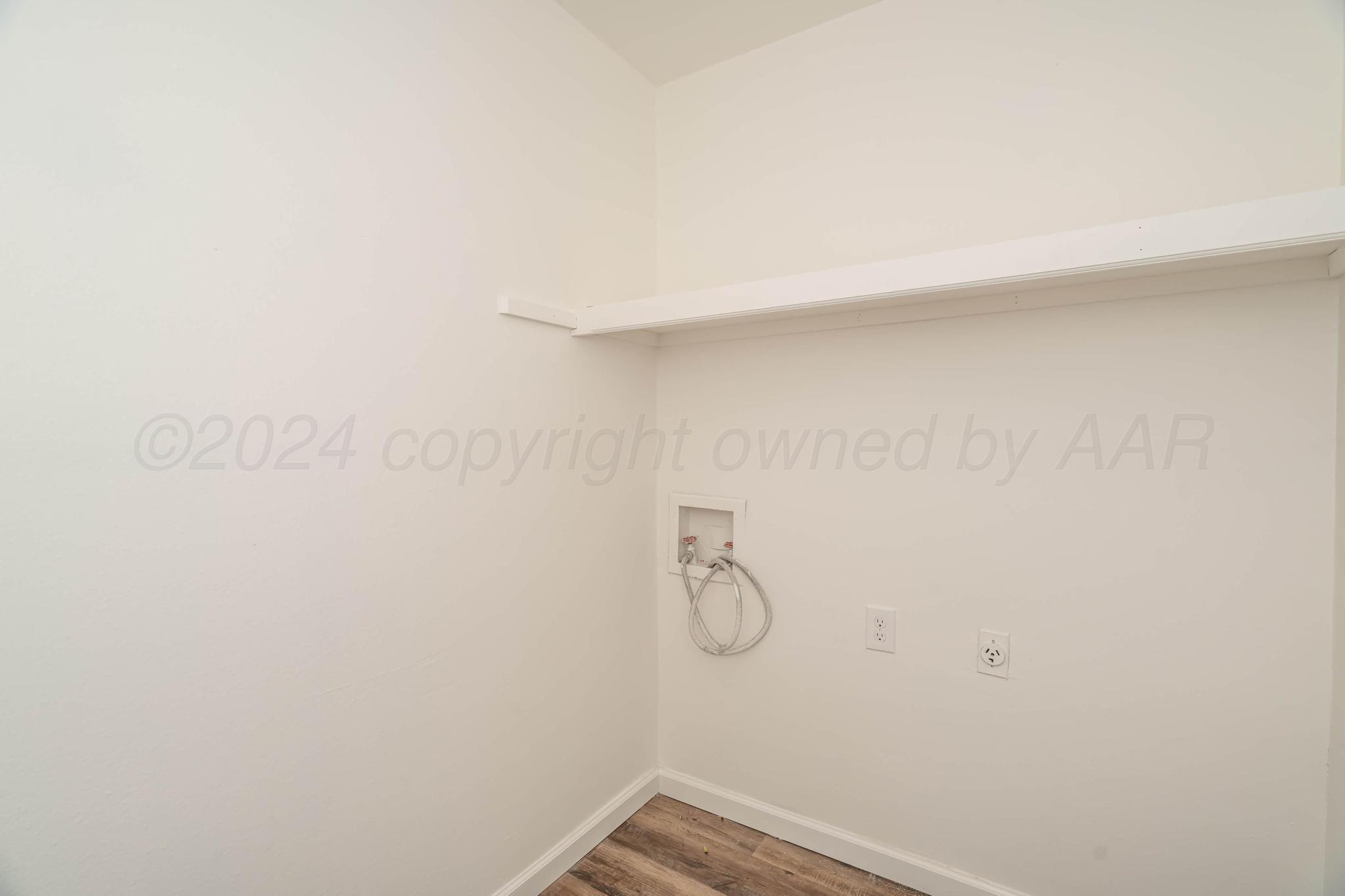 3206 Wind Song Drive Amarillo, TX 79103 - Photo 12 of 27 a view of a room with racks on the wall