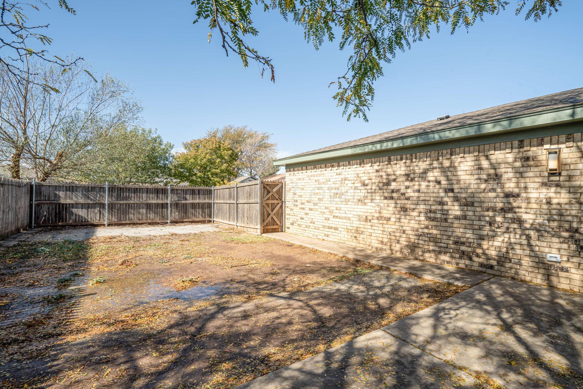3206 Wind Song Drive Amarillo, TX 79103 - Photo 24 of 27 a view of back yard with an outdoor space