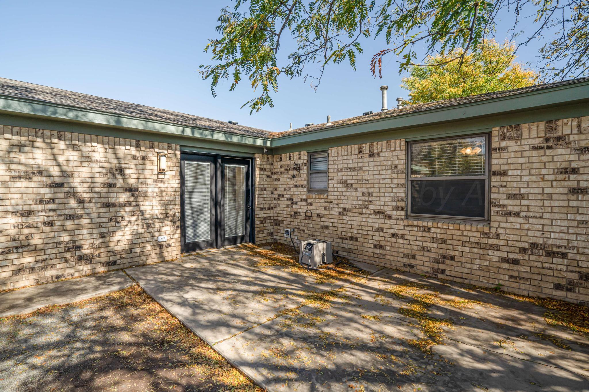 3206 Wind Song Drive Amarillo, TX 79103 - Photo 25 of 27 a front view of a house with a yard
