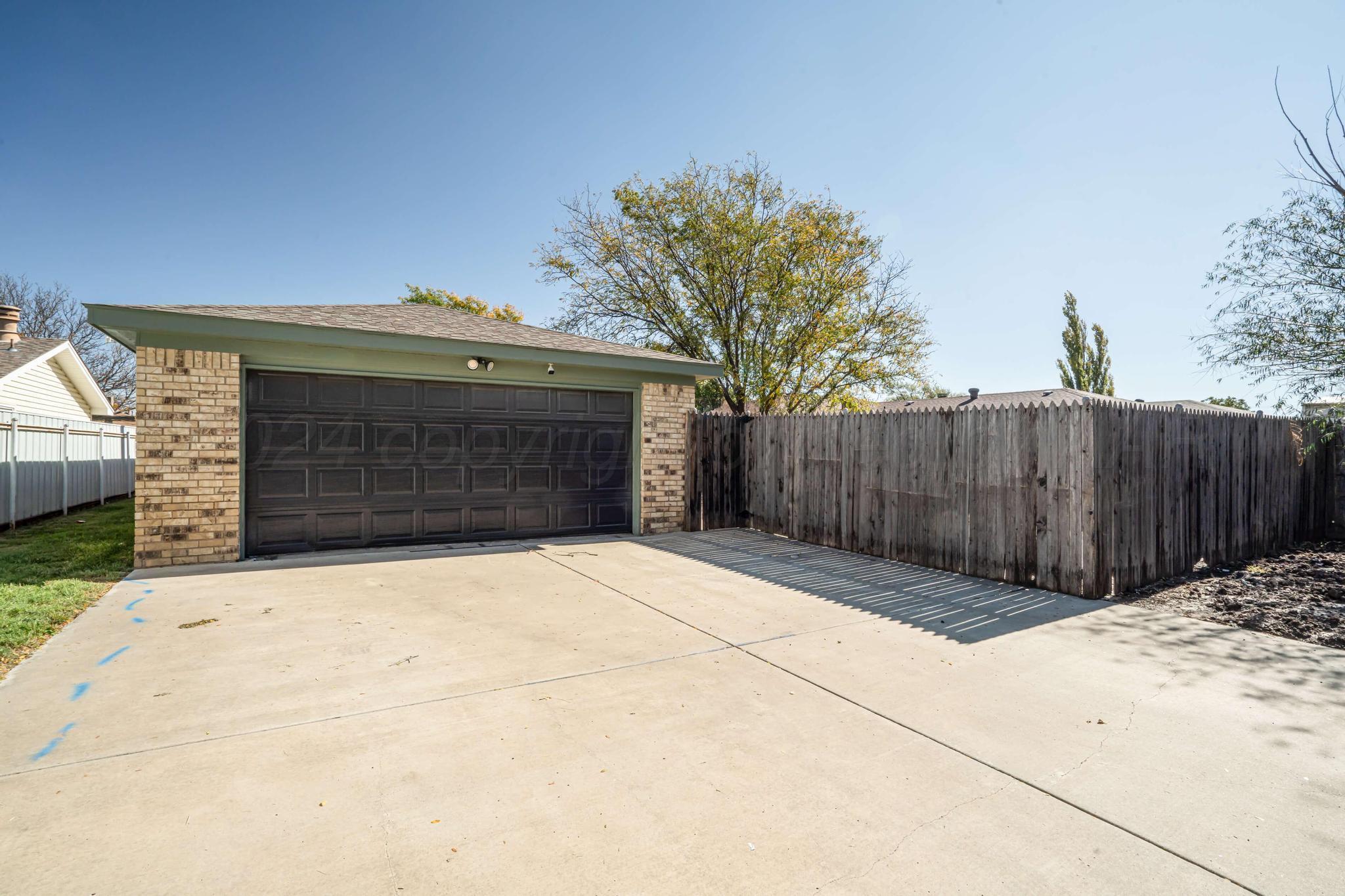 3206 Wind Song Drive Amarillo, TX 79103 - Photo 27 of 27 a front view of a house with a garage