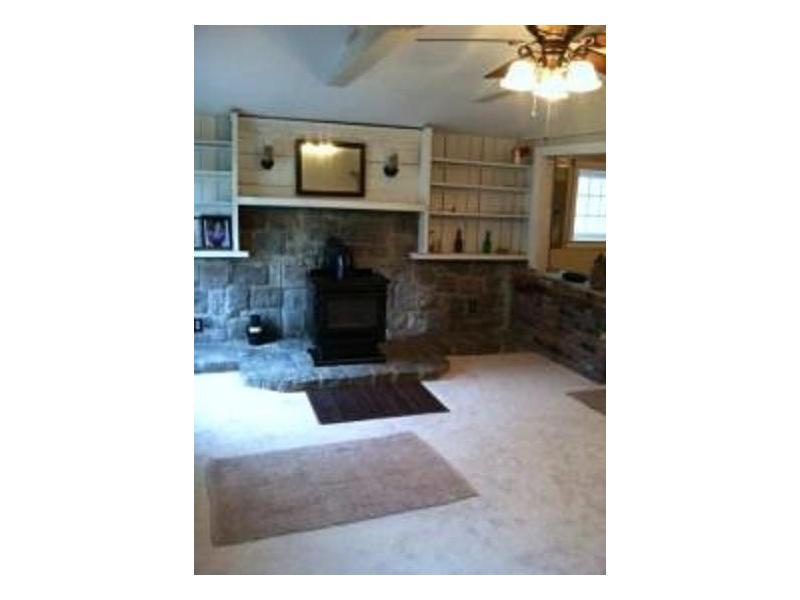 174 William Henry Road Scituate, RI 02857 - Photo 2 of 6 Living Room. Living room / front room - cathedral ceiling, beams, 2 new windows and carpeting