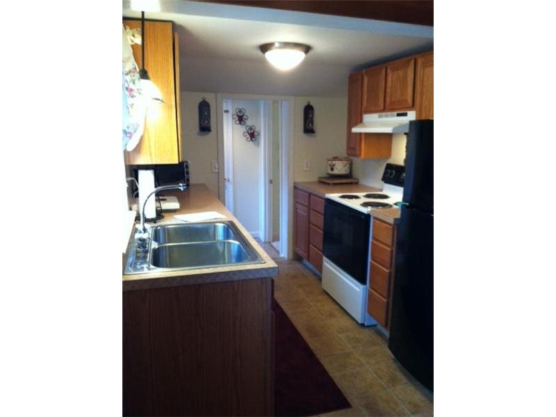 174 William Henry Road Scituate, RI 02857 - Photo 3 of 6 Kitchen. Galley kitchen - new appliances and new window above the sink