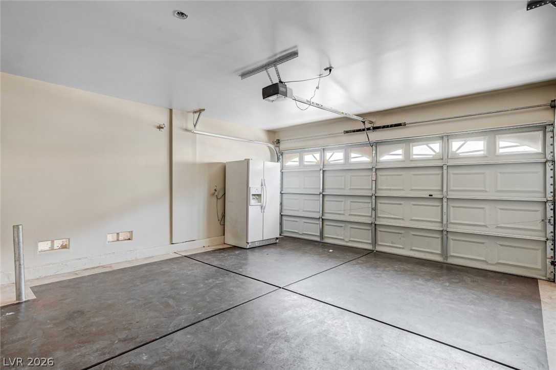7259 Cestrum Road Las Vegas, NV 89113 - Photo 25 of 35 Ample space for vehicles and storage with a durable concrete floor.
