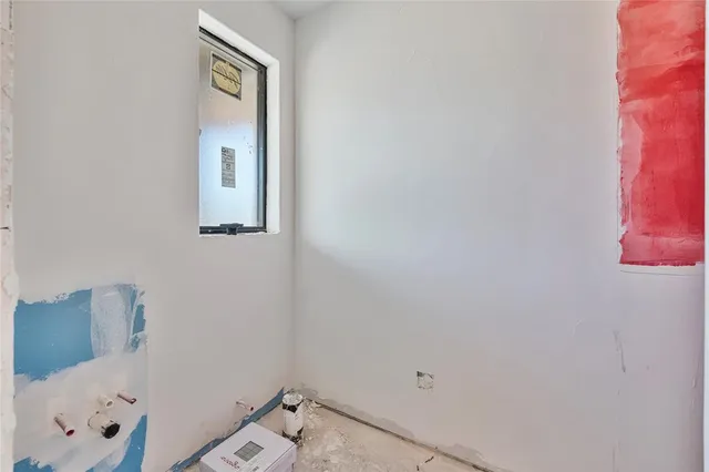 a bathroom with a window and shower