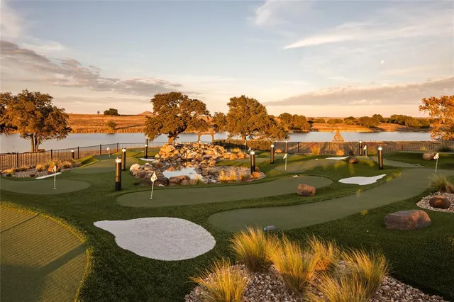 an aerial view of a house with a lake view