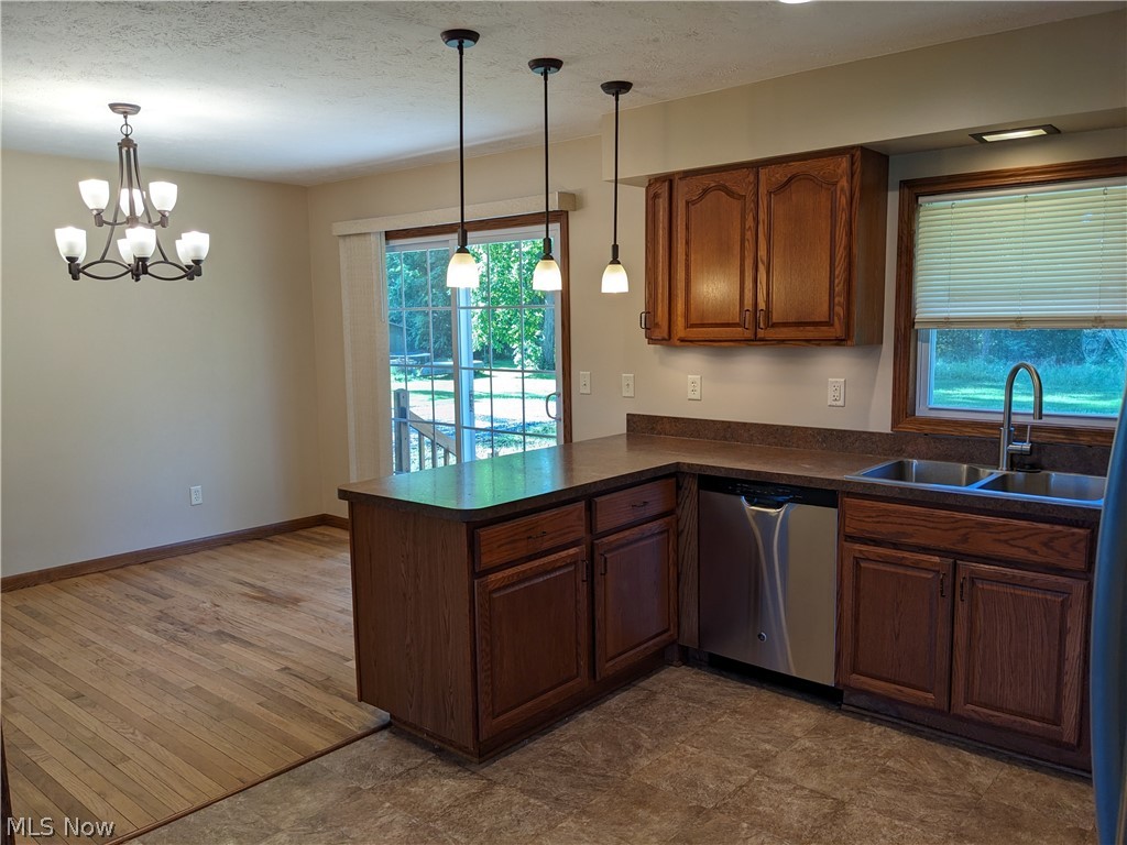 759 East Pleasant Home Road Wooster, OH 44691 - Photo 6 of 31 Kitchen featuring dishwasher, hanging light fixtures, sink, and plenty of natural light