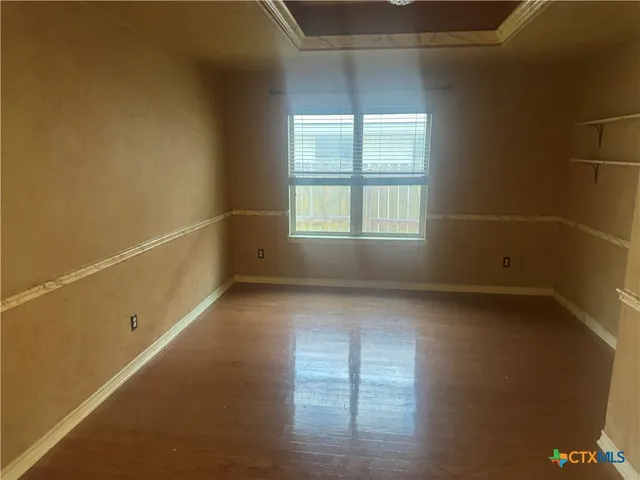 an empty room with a empty space and windows