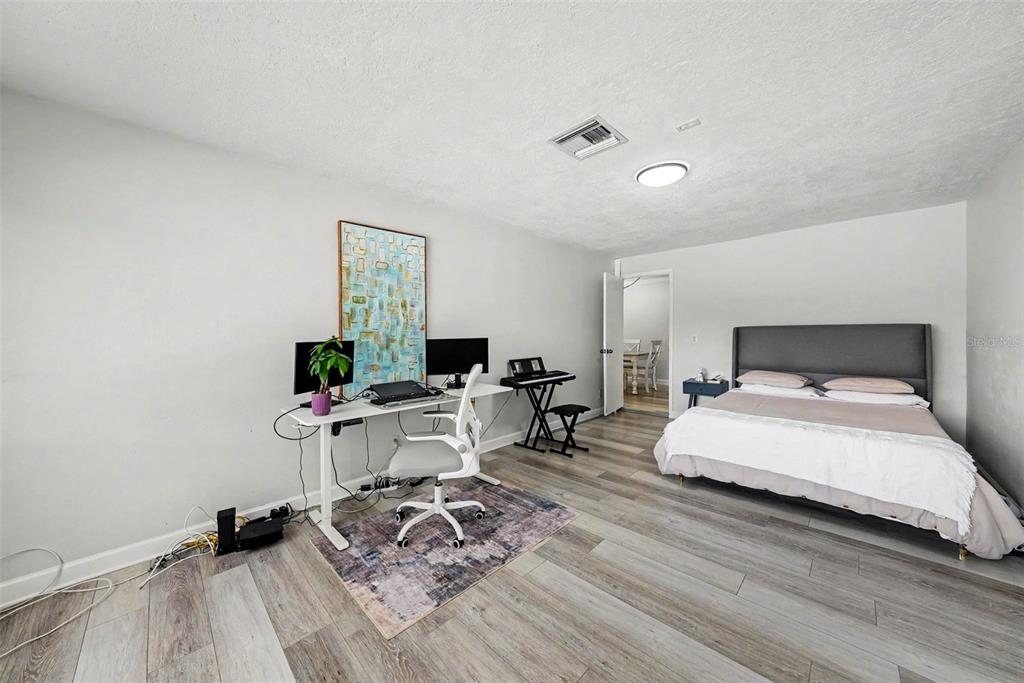 9204 Golf View Drive New Port Richey, FL 34655 - Photo 23 of 33 a bedroom with bed and a window