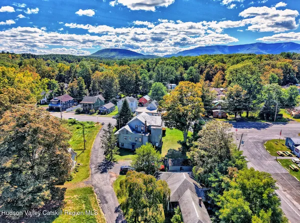 a aerial view of a house with a yard