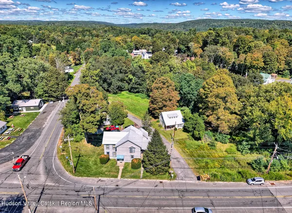 an aerial view of house with yard