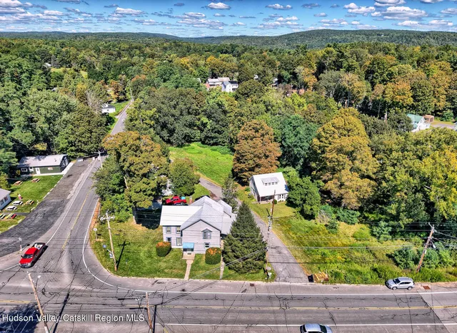 an aerial view of house with yard