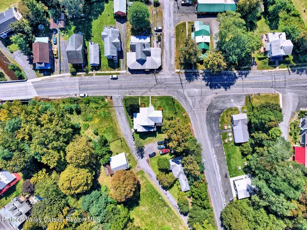 a kitchen with granite countertop a refrigerator stove top oven and sink