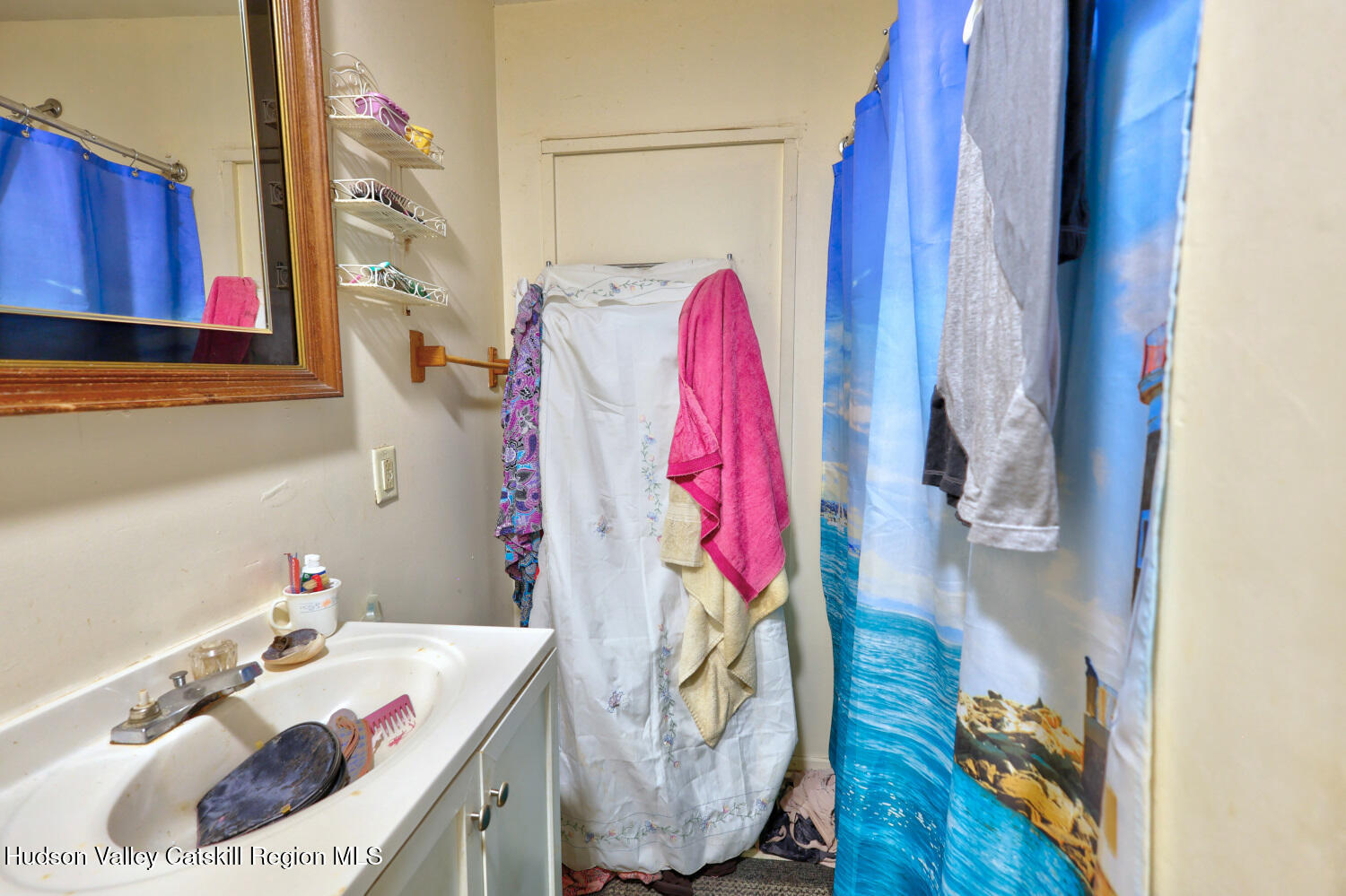 606 Main Street Cairo, NY 12413 - Photo 25 of 70 a bathroom with a sink and a mirror
