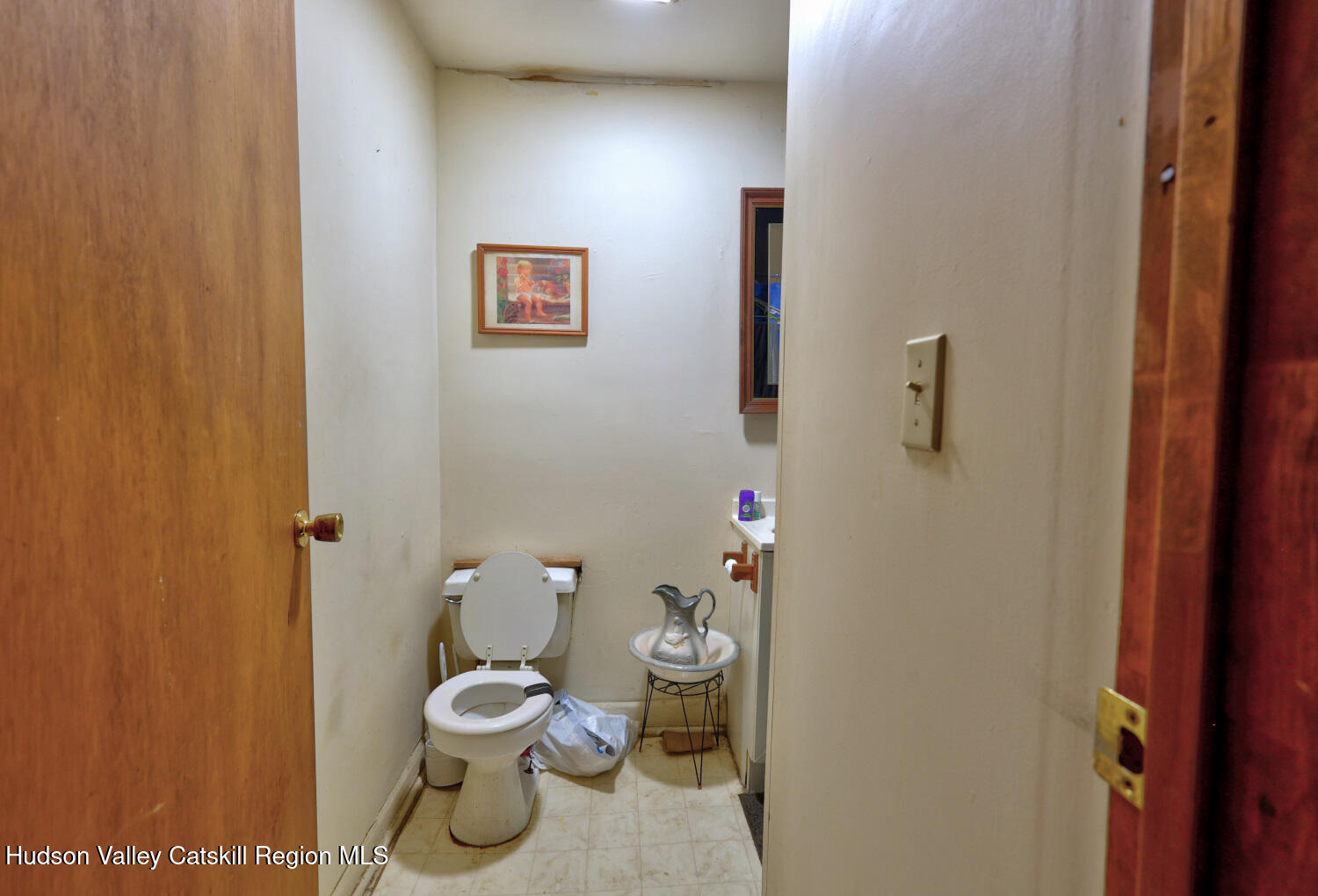 606 Main Street Cairo, NY 12413 - Photo 26 of 70 a bathroom with a toilet and a sink