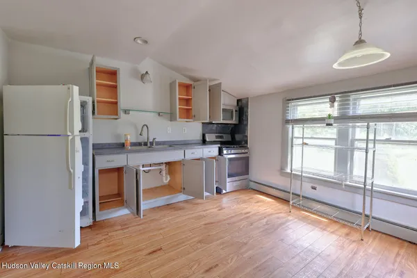a bathroom with a shower and a sink