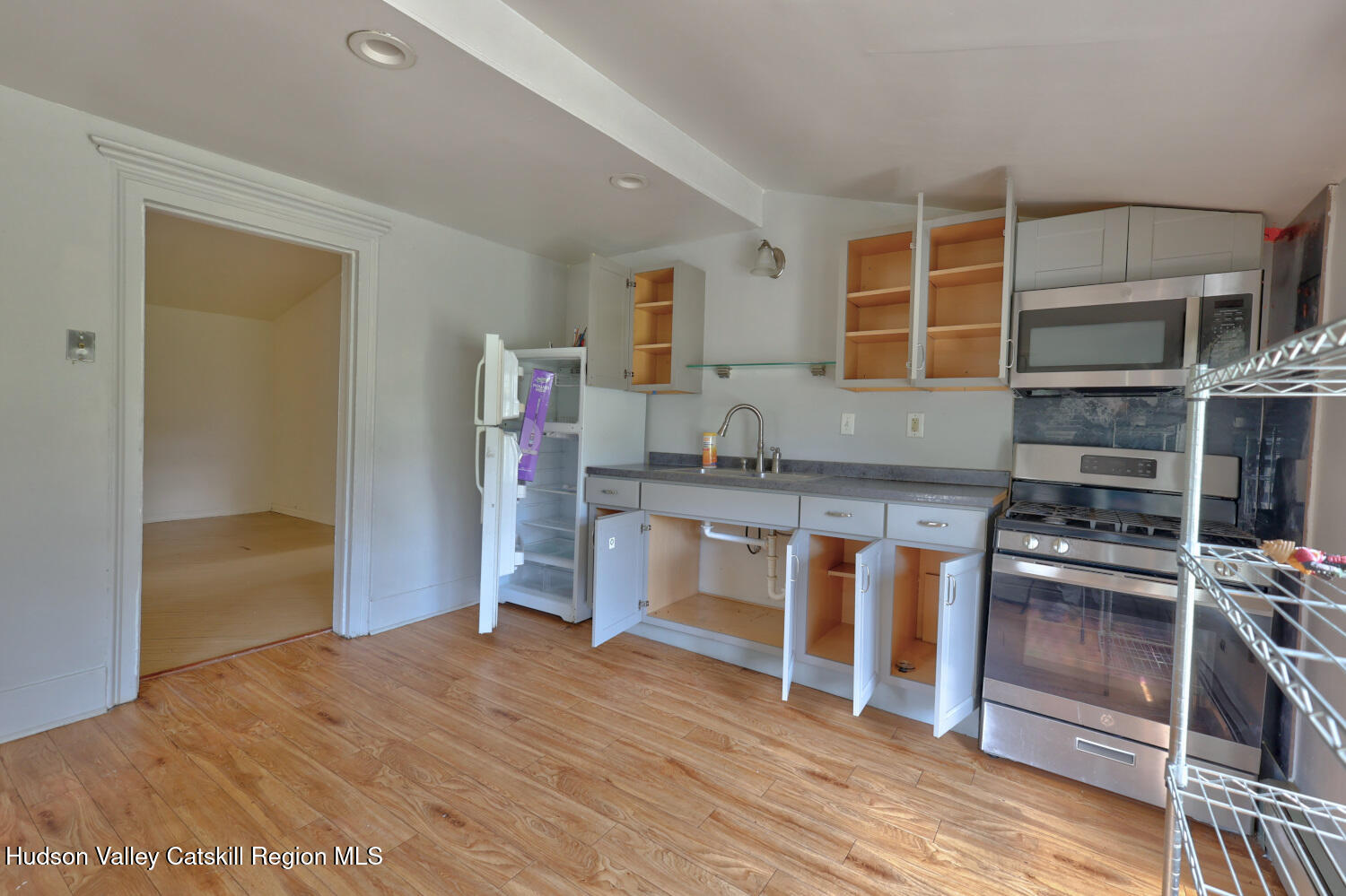 606 Main Street Cairo, NY 12413 - Photo 28 of 70 a kitchen with stainless steel appliances granite countertop a stove and a refrigerator