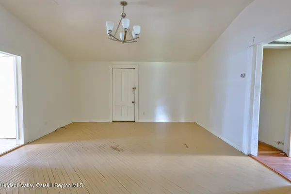 a bathroom with a sink mirror and vanity