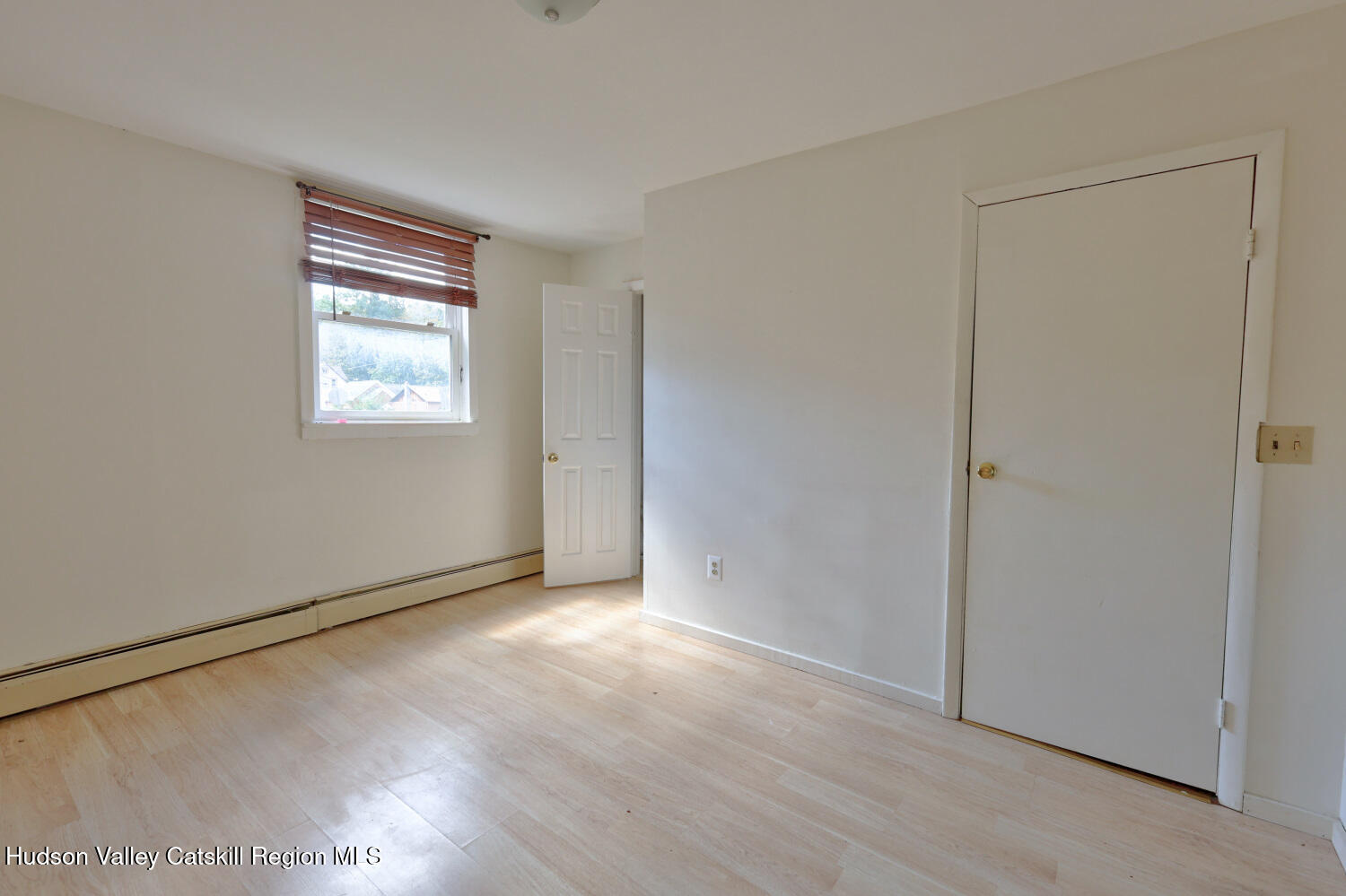 606 Main Street Cairo, NY 12413 - Photo 34 of 70 an empty room with wooden floor and windows