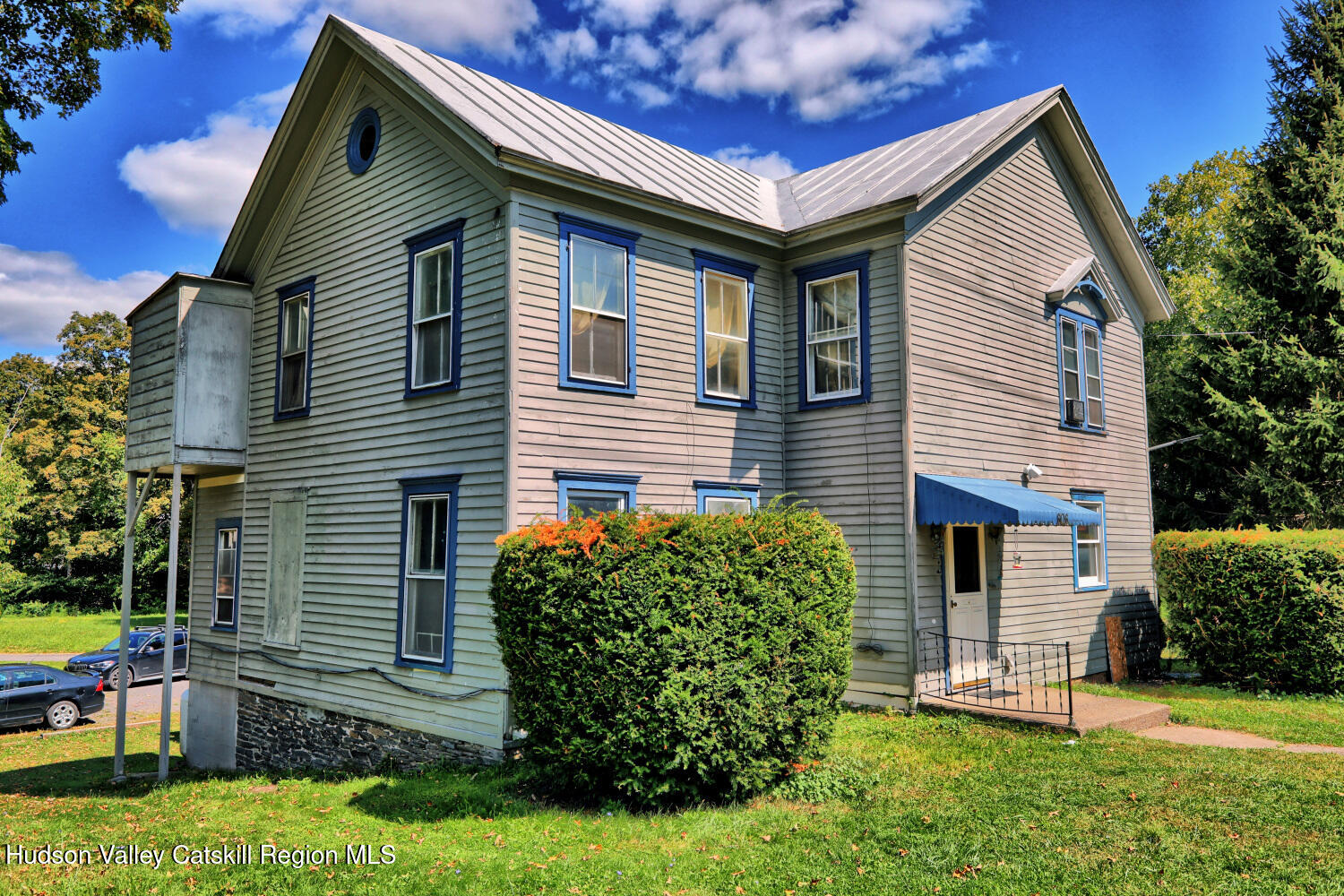606 Main Street Cairo, NY 12413 - Photo 4 of 70 a front view of a house with a yard