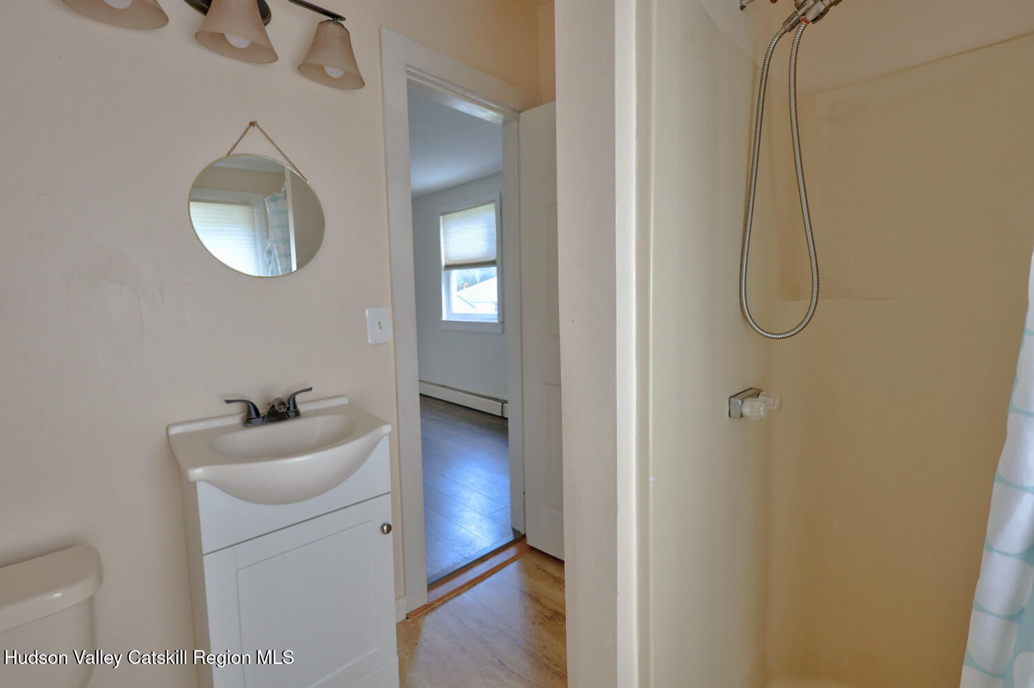 606 Main Street Cairo, NY 12413 - Photo 41 of 70 a bathroom with a sink mirror and vanity