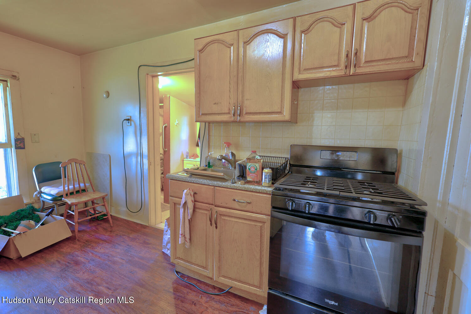 606 Main Street Cairo, NY 12413 - Photo 44 of 70 a kitchen with stainless steel appliances granite countertop a stove and a wooden cabinets