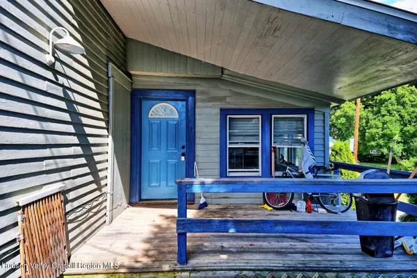 a front view of house with a garden