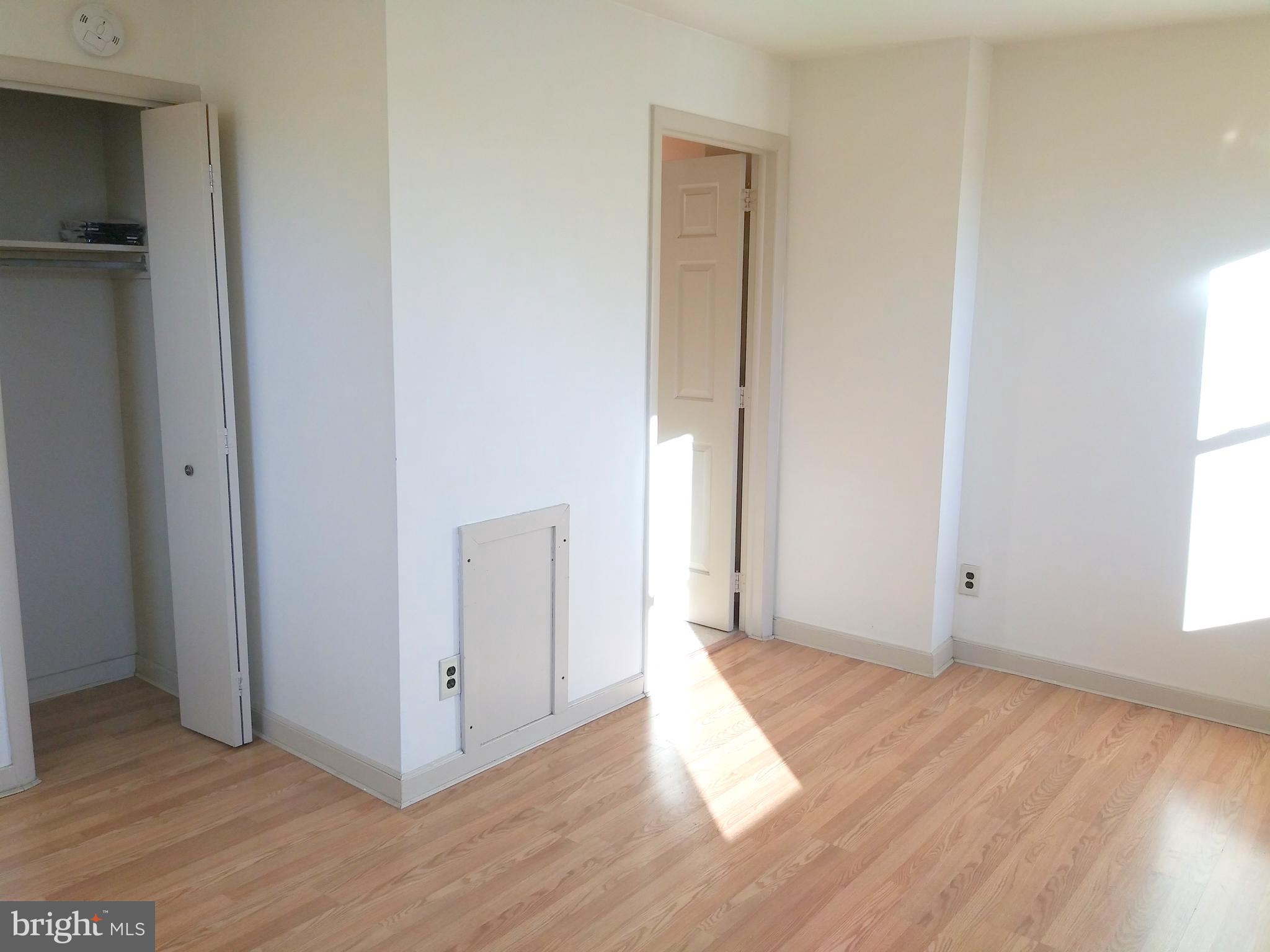 715 South 23rd Street, Unit 1F Philadelphia, PA 19146 - Photo 9 of 12 a view of a room with wooden floor and windows