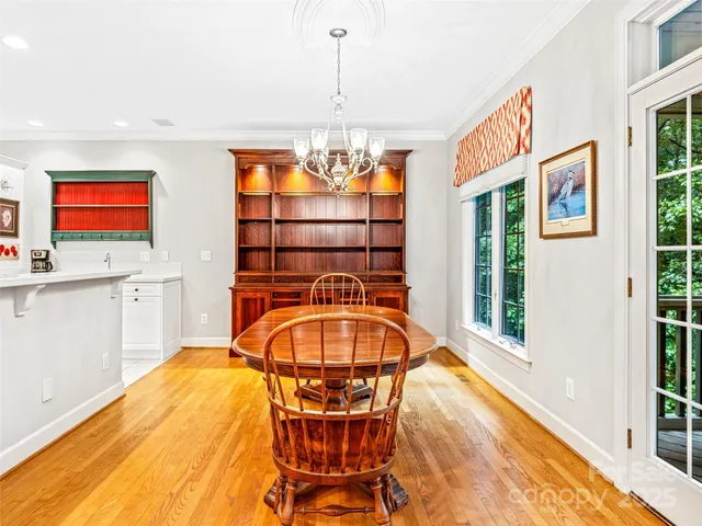 a kitchen with a refrigerator and white cabinets