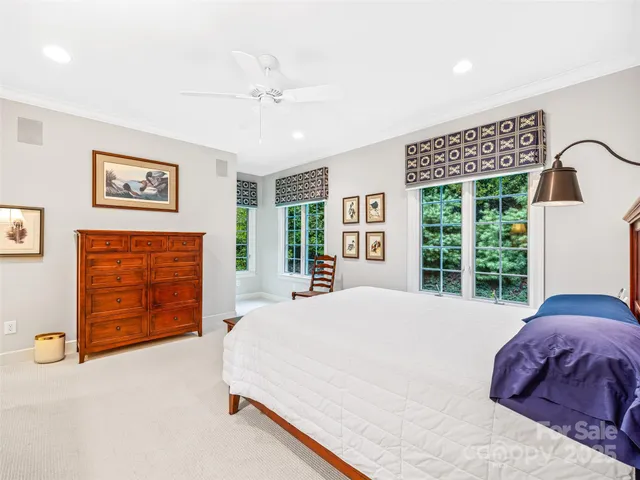 a view of entryway bedroom and hall with wooden floor