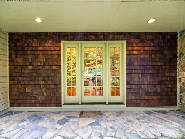 a view of a room with windows and chandelier