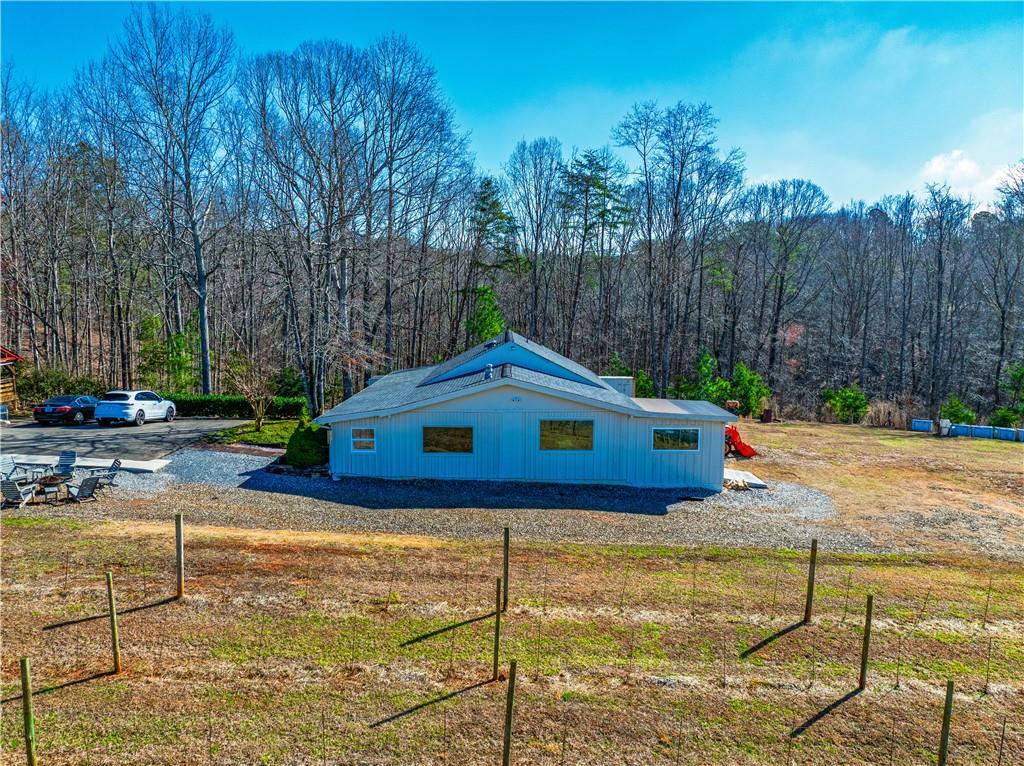 110 Rathgeb Trail Jasper, GA 30143 - Photo 13 of 62 a backyard of a house with table and chairs