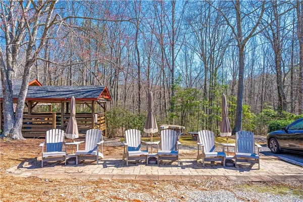 a view of a dining area with furniture and a flat screen tv