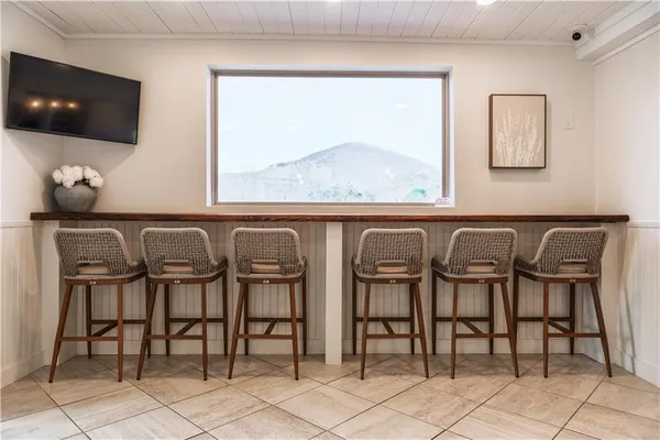 a view of a kitchen with furniture and a window
