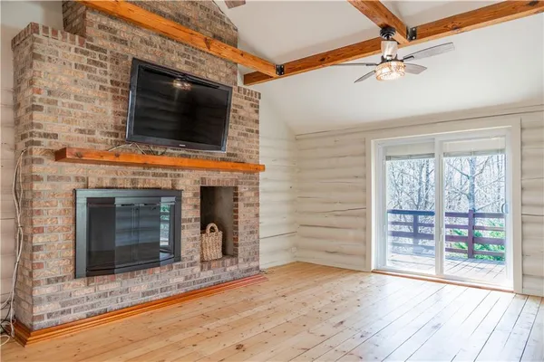 a view of a hallway with furniture and window