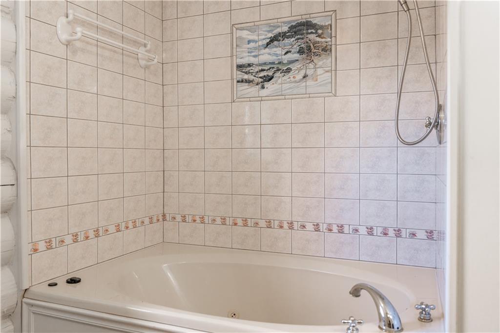 110 Rathgeb Trail Jasper, GA 30143 - Photo 46 of 62 a bathroom with a bathtub and shower