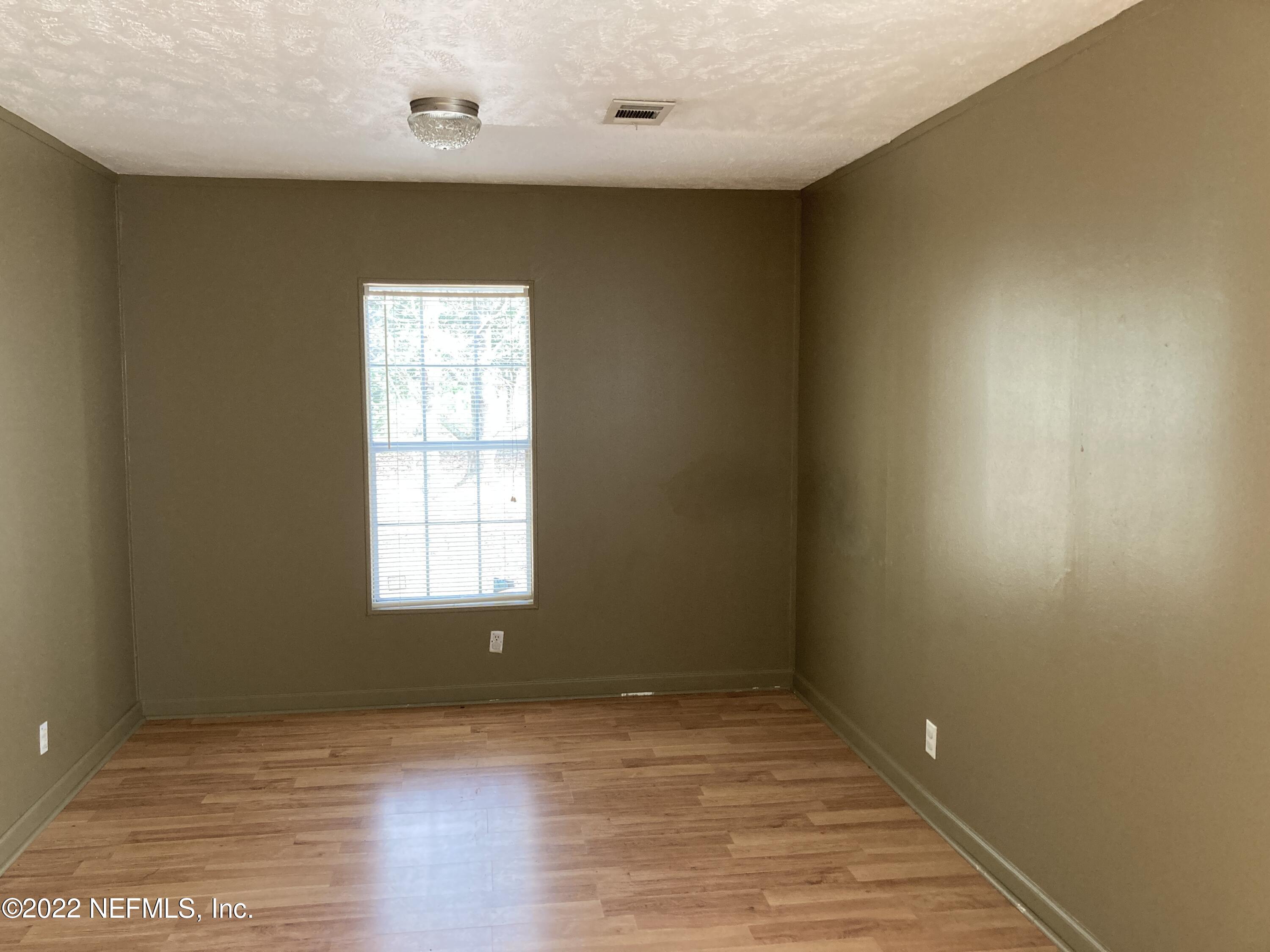 1352 Long Bay Road Middleburg, FL 32068 - Photo 6 of 13 a view of an empty room and window