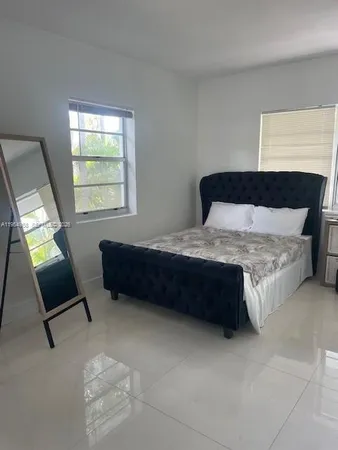 a living room with a couch and a flat screen tv